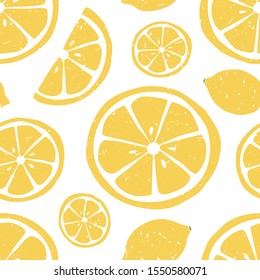 Lemon seamless pattern. Ripe lemon and lemon slice on white background.  Can be used for wallpaper, fabric, wrapping paper or decoration. Vector hand drawn illustration