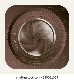 lens of camera over vintage background app icon