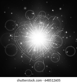 Lens flare background with shimmering lights. Wedding decoration with shiny hearts on a dark backdrop.