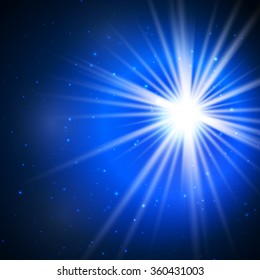 Lens flare. Flash bright spotlight on a dark blue background and the rays of glare.