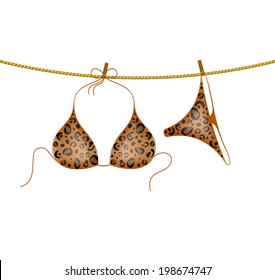 Leopard bikini suit hanging on rope
