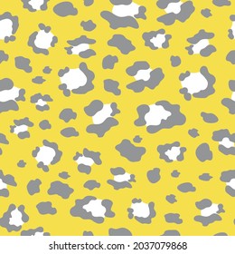 Leopard is in fashion. Seamless pattern with spots of wild animals for modern fabrics, textiles, decorative pillows, bed linen. Yellow and gray colors 2021. Vector.