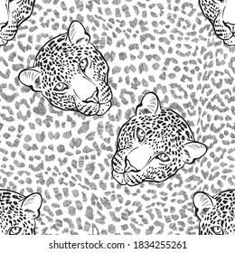 Leopard fur texture and  leopard faces. Seamless pattern. Hand-drawn vector illustration. Animal art background.