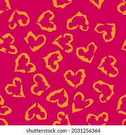 Leopard heart seamless pattern. Vector animal print. Orange spots on bright pink background. Jaguar, leopard, cheetah, panther fur. Leopard skin imitation can be painted on clothes or fabric.