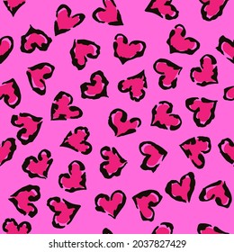 Leopard heart seamless pattern. Vector animal print. Black and magenta spots on pink background. Jaguar, leopard, cheetah, panther fur. Leopard skin imitation can be painted on clothes or fabric.
