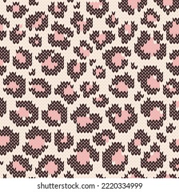 Leopard jacquard knitted seamless pattern with pink spots. Background for knitwear design or print. Vector illustration.