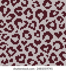 Leopard jacquard knitted seamless pattern with heart shape spots. Brown on white background for knitwear design or print. Vector illustration.