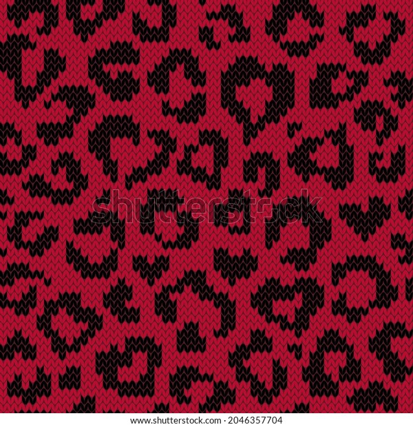 Leopard jacquard knitted seamless pattern\
with heart shape spots. Red and black background for knitwear\
design or print. Vector\
illustration.