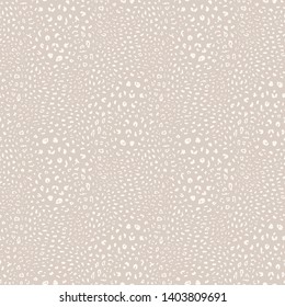 Leopard print pattern. Vector seamless background. Subtle animal skin texture of jaguar, leopard, cheetah, panther, puma. White and beige pattern with small spots, dots. Repeatable decorative design