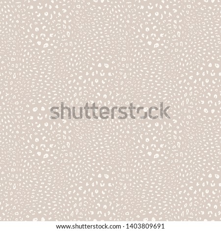 Leopard print pattern. Vector seamless background. Subtle animal skin texture of jaguar, leopard, cheetah, panther, puma. White and beige pattern with small spots, dots. Repeatable decorative design