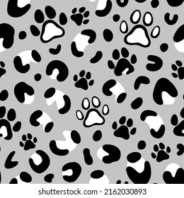 Leopard print with paw of dogs and cats. Cat paw pattern. Camouflage leopard vector seamless pattern on gray background. Leopard skin texture. 