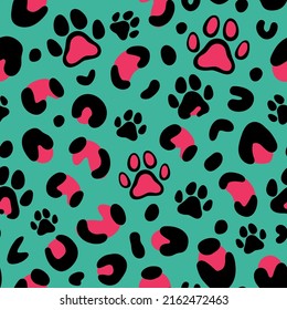 Leopard print with paw of dogs and cats. Cat paw pattern. Camouflage leopard vector seamless pattern on green background. Leopard skin texture. 