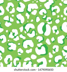 Leopard print seamless pattern. Fashion. Dark and white spots on a green background. Print on fabric on paper. Vector