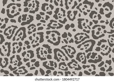 Leopard print. Trendy seamless vector print. The texture of the animals. Jaguar spots on a beige background. Imitation of cheetah skin painted on clothes or fabric, modern textile