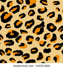 Leopard seamless pattern. Animal pattern in yellow, black and orange color.