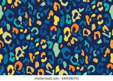 Leopard seamless pattern in bright blue, yellow, orange colors. Spotted texture. Trendy animal print in vintage style. Retro design. Hand drawn vector illustration.