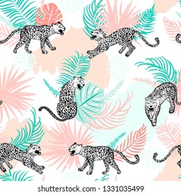 Leopard seamless pattern. Composition with leopards in different poses. Abstract brush strokes and tropical leaves. Vector illustration for textile, fabric, wrapping paper, background and packaging.