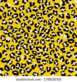 Leopard seamless pattern. Vector animal print. Black and white spots on a yellow background. Jaguar, leopard, cheetah, panther fur. Leopard skin imitation can be painted on clothes or fabric.