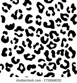 Leopard seamless pattern. Vector animal print. Black spots on a white background. Jaguar, leopard, cheetah, panther fur. Leopard skin imitation can be painted on clothes or fabric.