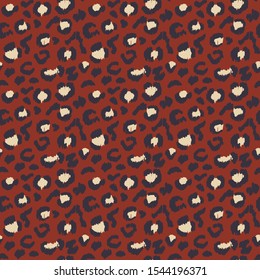 Leopard skin. Animal print. Texture with foil effect. Ikat geometric folklore ornament. Vector seamless pattern. Tribal ethnic texture.