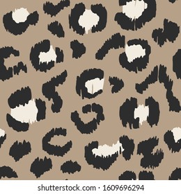 Leopard skin. Animal print. Texture with foil effect. Ikat geometric folklore ornament. Vector seamless pattern. Tribal ethnic texture.