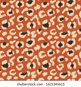 Leopard skin. Animal print. Texture with foil effect. Ikat geometric folklore ornament. Vector seamless pattern. Tribal ethnic texture.