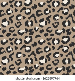 Leopard skin. Animal print. Texture with foil effect. Ikat geometric folklore ornament. Vector seamless pattern. Tribal ethnic texture.