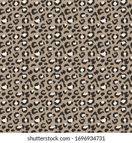 Leopard skin. Animal print. Texture with foil effect. Ikat geometric folklore ornament. Vector seamless pattern. Tribal ethnic texture.