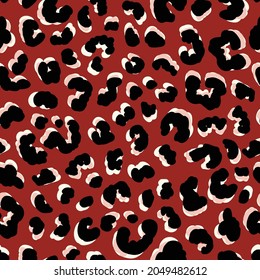 Leopard skin graphic with shadows seamless repeat pattern. Random placed, vector animal spots all over print on reddish brown background.