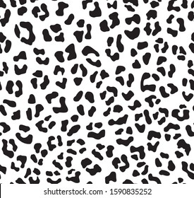 Leopard skin pattern seamless. Black spots on a white background. Vector.