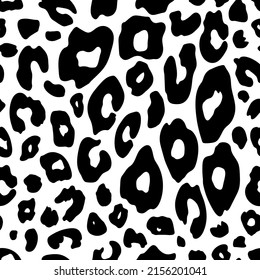 Leopard skin seamless pattern. Black spots on a white background. Vintage animal print from the 80s-90s. Vector illustration.