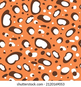 Leopard skin seamless pattern. Cartoon jaguar spots print design. Hand drawn leopard print. Wild orange vector illustration. Graphic leopard shapes pattern texture background.