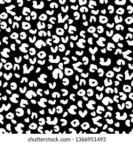 Leopard skin seamless pattern. Random Leopard print on black background. Vector