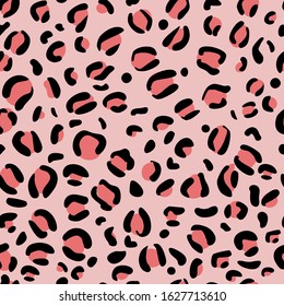 Leopard spots seamless pattern on pink background. Yellow-orange animal print. Trends. Black spot. Wildlife. Textile print. Vector illustration