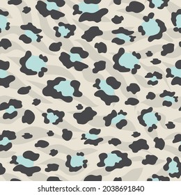 The leopard is trendy. Seamless pattern with wild animal blue and black spots for modern fabrics, textiles, throw pillows, bedding. Gray background. Vector.