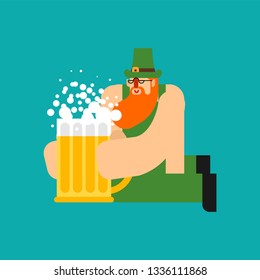 Leprechaun and Beer mug ale. St. Patricks Day character. Irish holiday. Dwarf in green hat