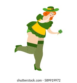 Leprechaun girl with red hair Find clover. Beautiful woman in green hat and Shamrock. St.Patrick 's Day. Holiday in Ireland