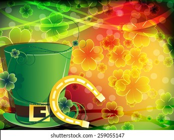 Leprechaun hat and horseshoe on abstract clover background.  St. Patrick's Day background