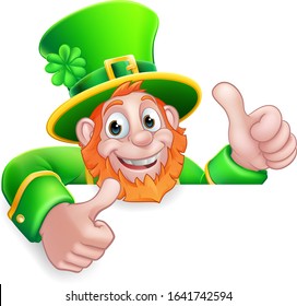 A Leprechaun St Patricks Day cartoon character giving a thumbs up and peeking over a sign. 