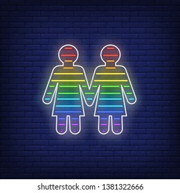 Lesbian couple neon sign. Rainbow colored girls shape, women, lgbt. Vector illustration in neon style for bright banners, light billboards, gay pride flyer