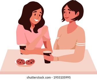 Lesbian couple on a date at cafe. First date or valentines day Romantic scene with lgbt family, marriage. Two women drinking coffee, talking and smiling. 