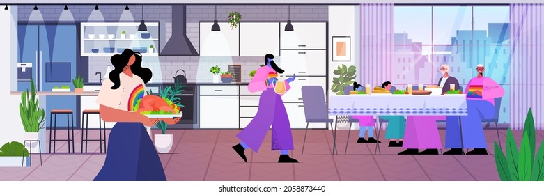 lesbian family with parents having lunch transgender love LGBT community concept kitchen interior horizontal