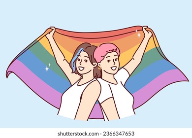 Lesbian women keep LGBT wet by participating in pride month parade and calling for more tolerant queer people. LGBT female fight for rights gays and transsexuals or transvestites from LGBTQ community