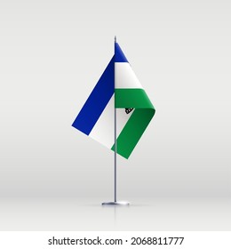 Lesotho Flaggenstaatsymbol einzeln auf nationalem Hintergrund. Grußkarte Nationaler Unabhängigkeitstag des Königreichs Lesotho. Illustrationsbanner mit realistischer Staatsflagge.