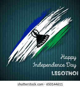 Lesotho Independence Day Patriotic Design. Expressive Brush Stroke in National Flag Colors on dark striped background. Happy Independence Day Lesotho Vector Greeting Card.