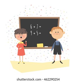 A lesson in class. Children at the blackboard. Math.