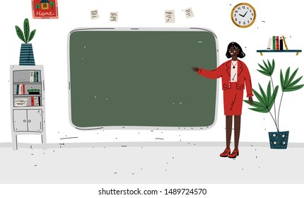 Lesson. Teacher standing near blackboard in classroom.