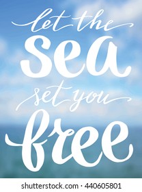 Let the sea set you free, hand written lettering on blur landscape background.