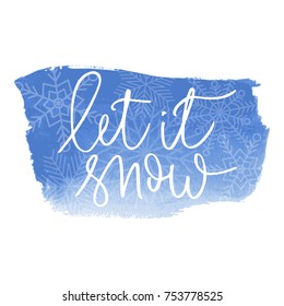 Let it snow a white hand written inscription with snowflakes on blue watercolour banner background