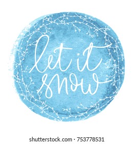 Let it snow a white hand written inscription on blue round watercolour banner background
